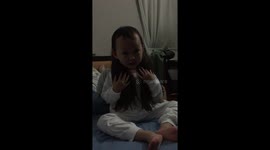 Little girl trying to have real long hair