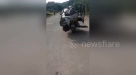 Little overloaded? Man carries motorcycle on top of his motorcycle