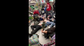 Extinction Rebellion demonstrators stage mass 'die-in' at London supermarket