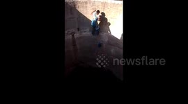 Indian women risk lives to fetch water from 60-foot deep well