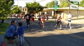 runner gives boy a high five at the Nashville Rock 'N' Roll Marathon