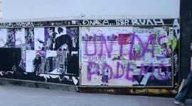 A graffiti of left party Unidas Podemos en las calles de Madrid, España