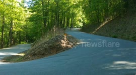 Skateboarders Descend the Switchbacks
