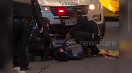 US Paramedics attend to cyclist hit by truck during aftermath footage