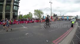 An Idiot On A  Bike Disrupts The London Marathon As He Cycles Around The Marathon Course In Westminster