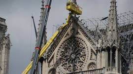 Fire of the Cathedral Notre-Dame de Paris. The statue above the rose window is removed to be restored by the SOCRA. More tarpolins and security nets are layed because of the expected wind and rain. 29 april 2019.