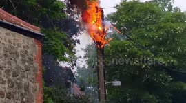Fiercely flaming electric pole threatens family home in Market Lavington