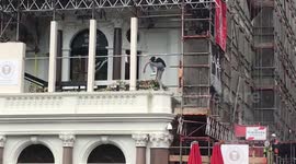 Ajax fan climbs onto restaurant's balcony to retrieve football in Leicester Square