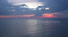 A beautiful sunrise sky over the ocean in Thailand.