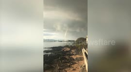Onlookers amazed by huge waterspout near Thai island