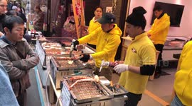 Tourists Buy Flame-Grilled Giant Tiger Prawns