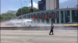 Venezuelan riot police deploy water cannon against rock-throwing protesters in Caracas