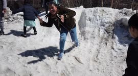 Delighted children play in the snow on Mount Fuji in Japan