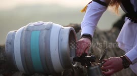 Morrismen dance and drink beer during May Day celebrations in Leicestershire