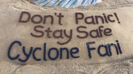 Sand artist carves message for Cyclone Fani in southeast India