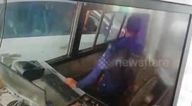 Cheeky monkey caught on camera stealing money from toll booth worker in northern India