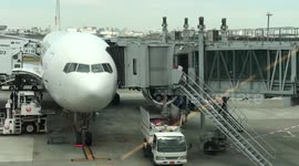 Airport Workers Throwing Rubbish Off Plane