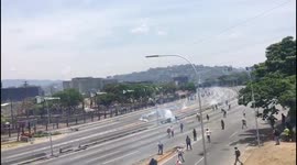Chaotic scenes as riot police fire tear gas at protesters in Caracas, Venezuela