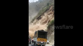 Terrifying moment motorists cheat death in landslide in Northern India