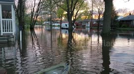 4 year old kayaking in local city flooding