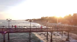 aerial view of pier at sunset- beautiful view filmed in marbella