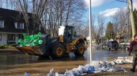 Volunteers help Montreal residents as spring floods break records in eastern Canada