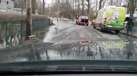 Lauzon street in pierrefonds, montreal quebec flooded out into the lake, waves crashing over the concrete walls and dikes while volunteers scramble to deliver sandbags and care packages