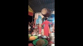 Women use their heads and mouths to lift heavy objects and dancing