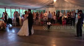 Boy wielding lightsaber appropriately breaks up first dance at 'May the Fourth' wedding as a Star Wars reminder