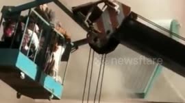 Hero drives crane to save residents trapped in building fire in northern China