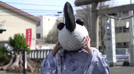 CLEAN VERSION: Shinto priest in Japan wears handmade panda mask to attract visitors to her shrine