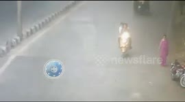 Brazen thieves snatch chain and drive on wrong side