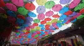 Thousands of colourful umbrellas hang over 'Silk Street' in Vietnam