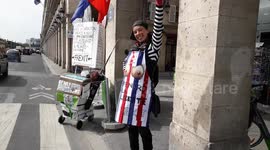 Anne Agius Dyer Gelicrisio (OliveBohxParis), pro FREXIT and humanitarian activist spotted holding the french flag face to the Louvre Museum, Paris, France, rue de Rivoli.7 may 2019