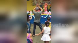 Supportive Filipino father steals the show after dancing along with daughter