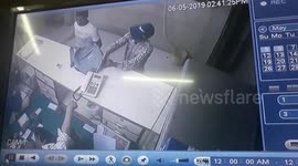 Brave businessman fights off armed robbers with bare hands