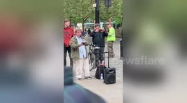 Preachers in Manchester argue across the street in 'Christian Soundclash'