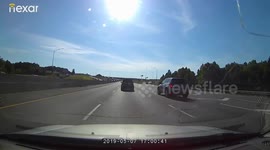 Truck Flies by on the shoulder in a construction zone endangering multiple drivers and LEO.