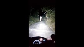 Spooky moment 'ghost woman' spotted wandering on road in China