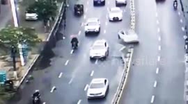 Car smashes through partition and flips onto another car in east China