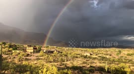 Rainbow arcs over Arizona desert following storm