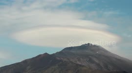 Spectacular footage of lenticular clouds moving over Mount Etna volcano
