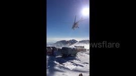 Russian power workers help build pylons at over 10,000-foot altitude