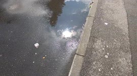 Sun reflecting in puddles of water