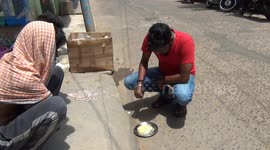 Sizzling heat wave used by man to fry eggs in east India