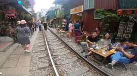 Cafe on Train street in Hanoi - Dangerous railtrack near homes