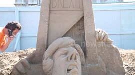 UK sand sculpture festival pays homage to Brexit with carving of Theresa May's head under a guillotine