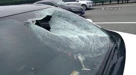 Flying panel smashes into car through windscreen, killing passenger