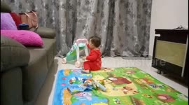 Baby suddenly screaming while playing his toys