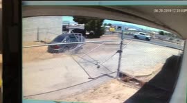 US driver fleeing police smashes through a business' fence to take a shortcut